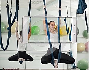 Portrait of woman doing antigravity yoga