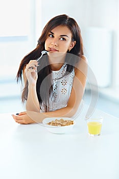 Portrait of woman eating cereals. Healthy eating. Health care. W