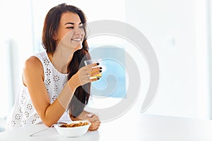 Portrait of woman enjoying her morning meal. Healthy eating. Hea