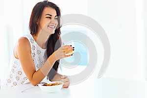 Portrait of woman enjoying her morning meal. Healthy eating. Hea