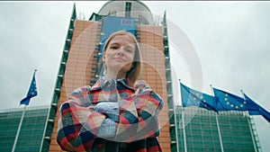 Portrait of Woman with EU Flags near European Commission in Brussels, Belgium