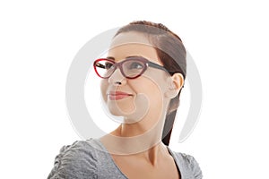 Portrait of a woman in eyewear looking up