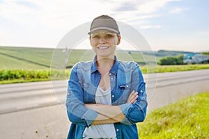 Portrait of woman farmer, agronomist in field with ripe corn