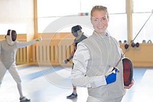 Portrait woman in fencing clothing