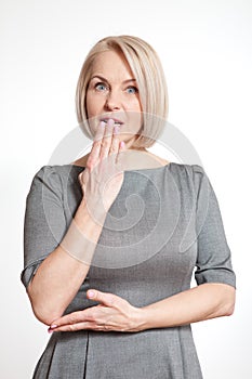 Portrait woman with finger on lips, or secret gesture hand sign isolated on white background