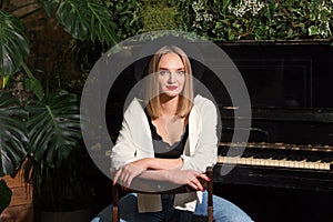 Portrait woman in front piano