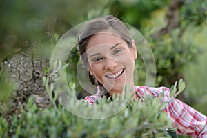 Portrait woman in garden on sunny day