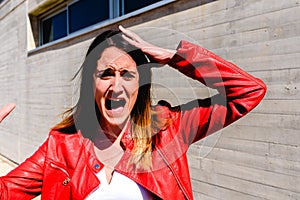 Portrait of woman with gesture of fear and fright when witnessing an accident