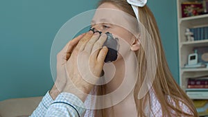 Portrait of a woman getting face mask