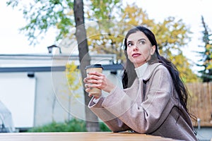 Portrait of woman with glass of coffee