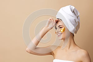 portrait woman golden patches on the face with a towel on the head close-up Lifestyle