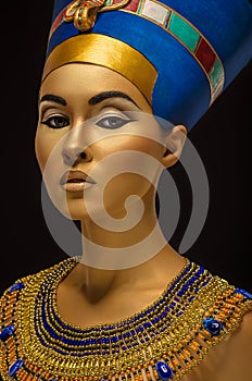 Portrait of woman with golden skin in Egyptian style