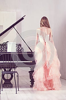 Portrait of woman with grand piano