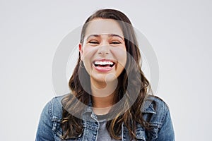 Portrait, woman and happy with laugh by studio background for mockup space, comic joke and excited expression. Smile