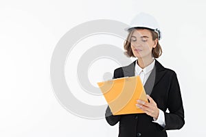 Portrait of a woman in hard hat and suit