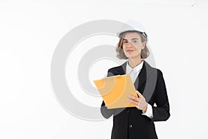 Portrait of a woman in hard hat and suit