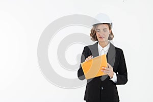 Portrait of a woman in hard hat and suit