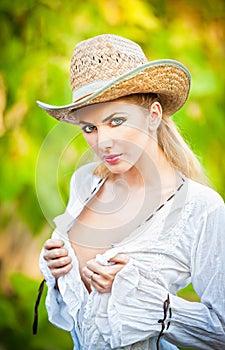 portrait woman with hat and white shirt