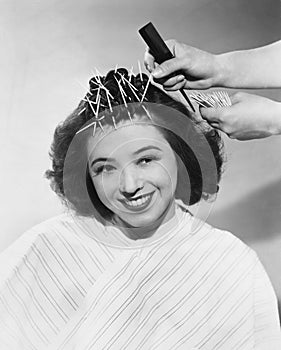 Portrait of woman having hair styled