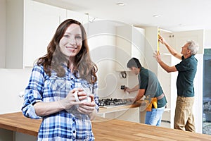 Portrait Of Woman Having New Kitchen Fitted photo