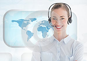 Portrait of woman in headset standing against world map