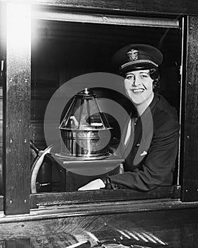 Portrait of woman at helm of boat