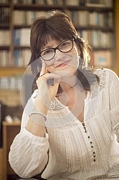 Portrait of woman in her studio, half body shot