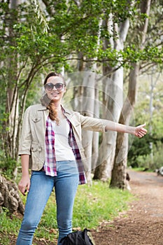 Portrait of woman hitch hiking