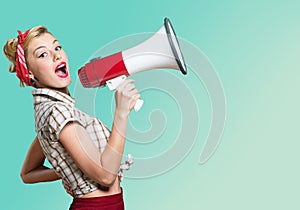 Portrait of woman holding megaphone, dressed in