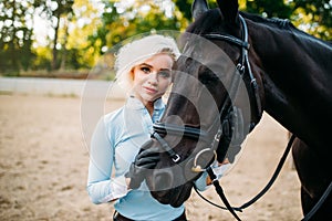 Portrait of woman and horse, horseback riding