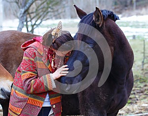 Portrait woman and horse in outdoor. Woman hugging
