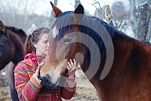 Portrait woman and horse in outdoor. Woman hugging