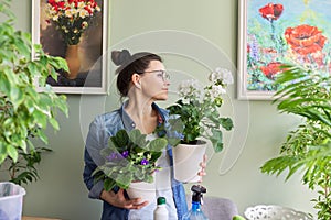 Portrait of woman with houseplants, hobbies and leisure, nature in the house