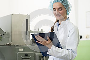 Portrait of woman inspector during quality control in factory