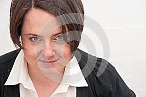 Portrait of woman with knowing smile photo