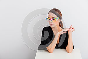 Portrait of woman in lagom style with rainbow eyeglasses