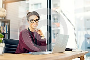 Portrait, woman and laptop in office with confidence for career, job growth and opportunity. Female employee, happy and