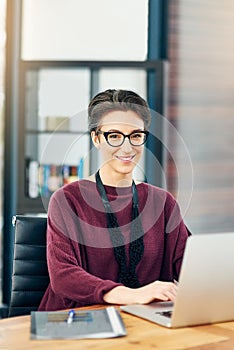 Portrait, woman and laptop in office with smile for career, job growth and opportunity in confidence. Female employee