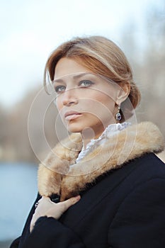 Portrait of woman of last century at autumn day