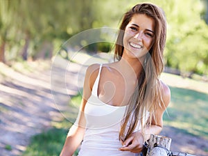 Portrait, woman or laugh for hair, fashion or summer in casual outfit with natural styling in park. Happy, female
