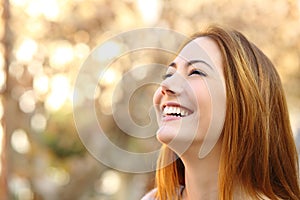 Portrait of a woman laughing with a perfect teeth