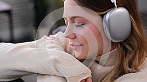 Portrait Of A Woman Listening Music In Headphones At Home