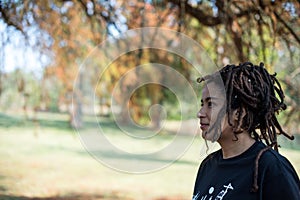 Portrait of woman with locs wrapped around her head