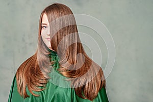 Portrait of woman with long brown hair