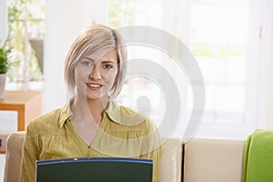 Portrait of woman looking at laptop