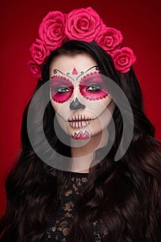 Portrait of a woman with makeup sugar skull