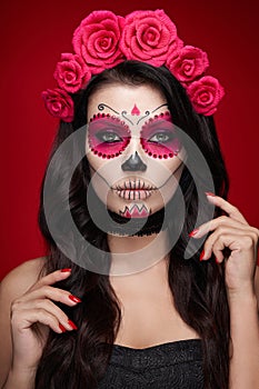 Portrait of a woman with makeup sugar skull