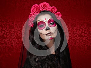 Portrait of a woman with makeup sugar skull