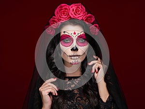 Portrait of a woman with makeup sugar skull