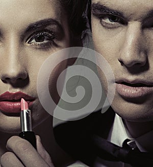 Portrait of a woman and man with lipstick